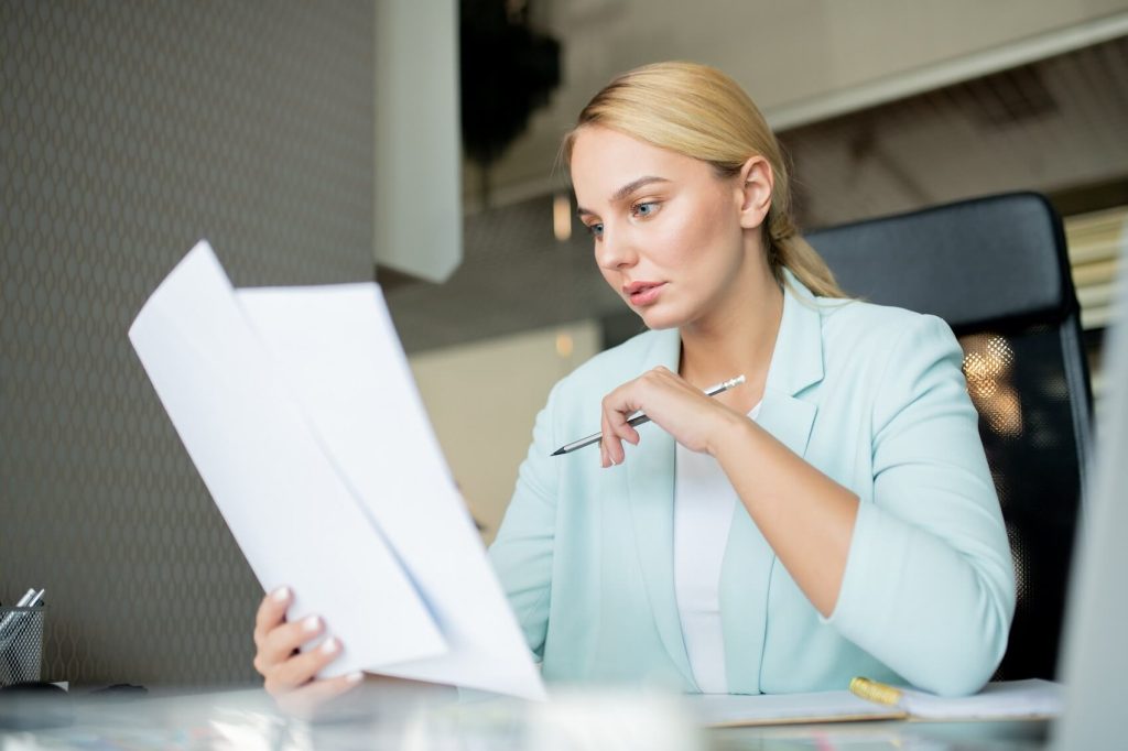Woman reading divorce papers
